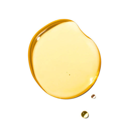 Natural oil drop on a solid white background by SHOLAYIDÉ eco-luxe haute parfumerie