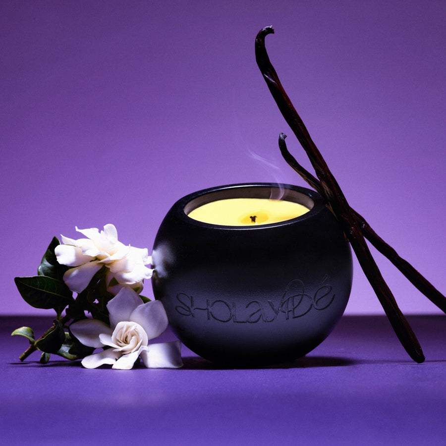PRAISED eco-luxe vegan scented candle by SHOLAYIDÉ paired with Tahitian Gardenia flowers and Vanilla.