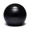 PRAISED by SHOLAYIDÉ, an eco-luxe vegan candle in a black sphere cement candle jar on a white background.