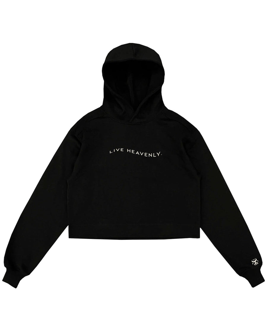 Cropped hoodie with white LIVE HEAVENLY embroidery by SHOLAYIDÉ laying on white background.