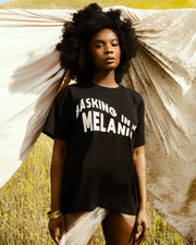 Our MELANIN t-shirt celebrates the poised & magical Black woman with an embroidered, wavy design of "Basking in My Melanin".