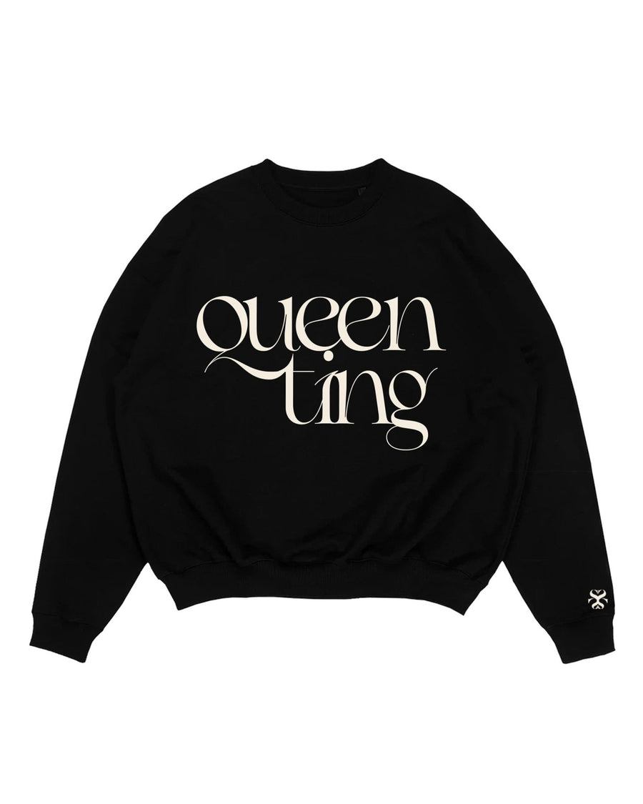 QUEEN black sweatshirt with cream Queen Ting embroidery detail by SHOLAYIDÉ laying on white background.